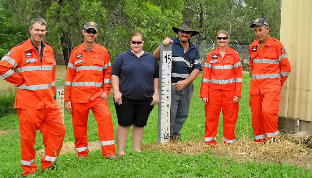 Theodore SES volunteer Matthew Stevens (fourth from left), who was killed after being run over by a fire truck on Friday night, with his brother Tim (second from left), wife Jessica (third from left) and Theodore SES leader Barry Denning (far right). Theodore SES volunteer Matthew Stevens (fourth from left), who was killed after being run over by a fire truck on Friday night, with his brother Tim (second from left), wife Jessica (third from left) and Theodore SES leader Barry Denning (far right).